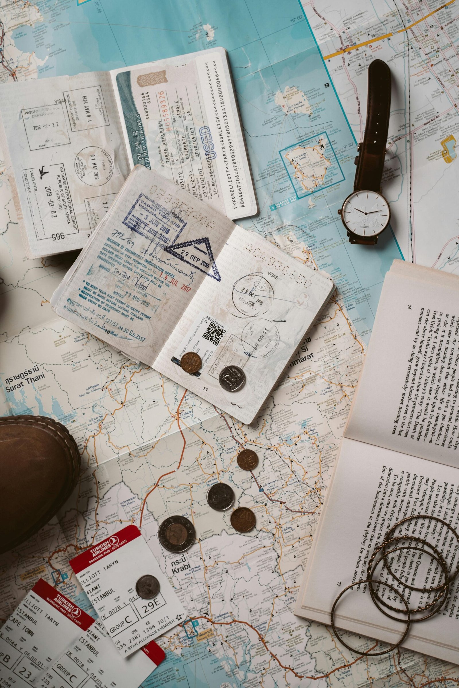 Explore wanderlust with flatlay of passport, map, and travel essentials.